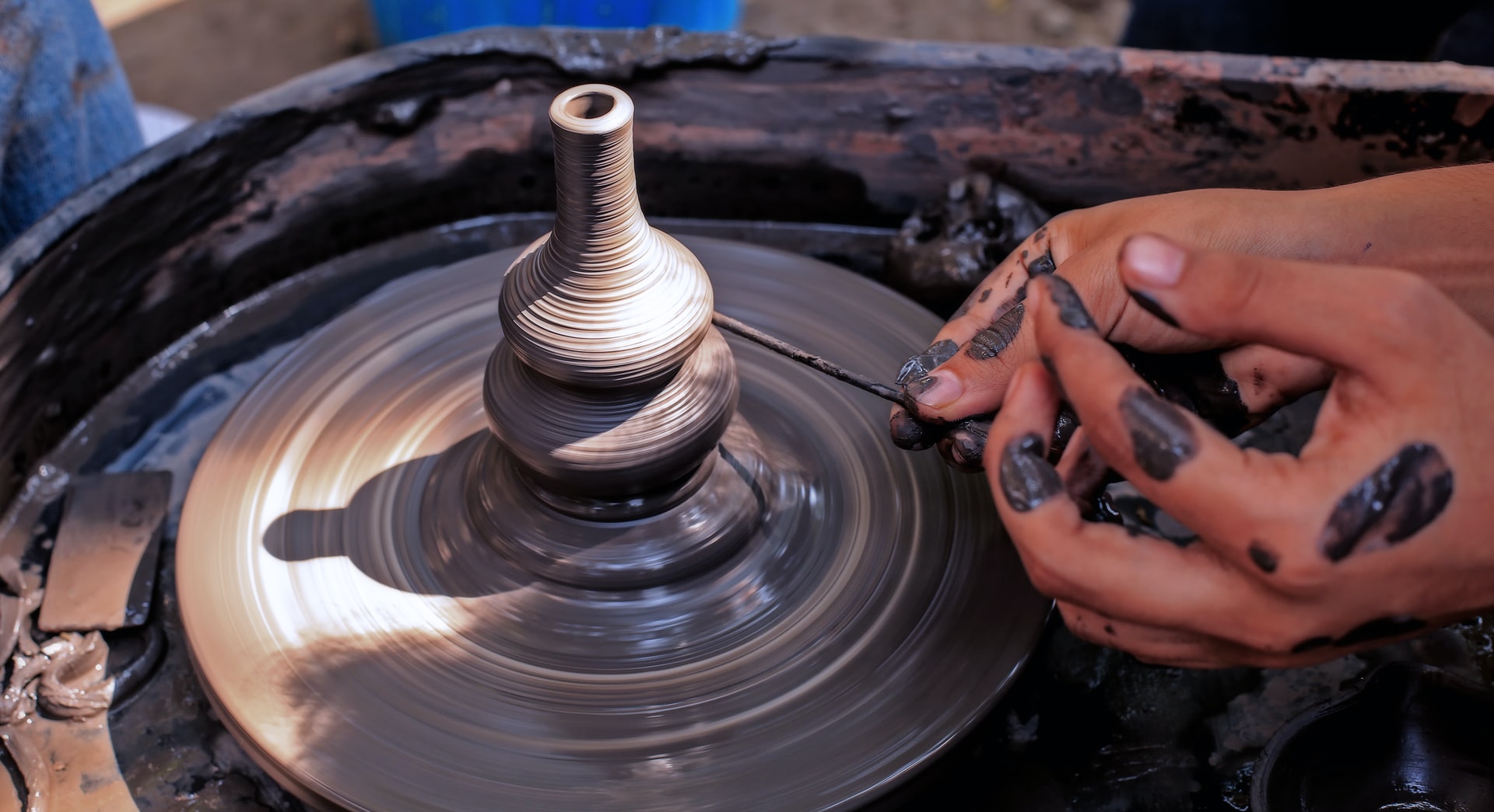 Art work of working on a Pottery wheels